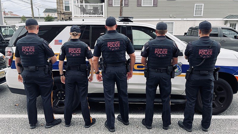 The officers display Mikenzie Helphenstine's words to live by. (Photo courtesy of the Ocean City Police Department)