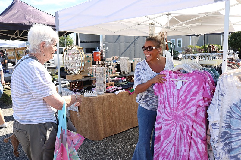 Vendor Trish Giova helps shopper, Eileen Volok, of Ocean City.