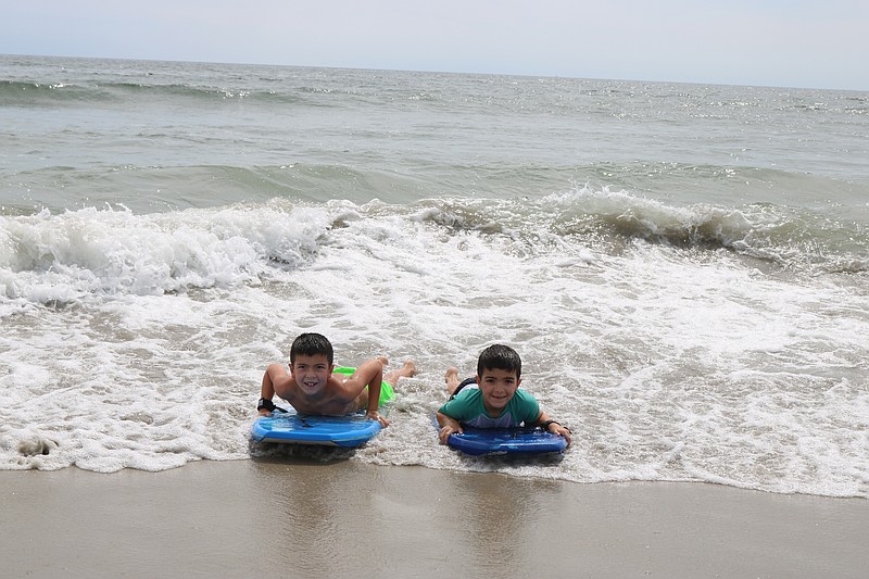 Parker Corley, at left, of Ocean City, with his brother, Ryan, enjoy some boogie boarding.