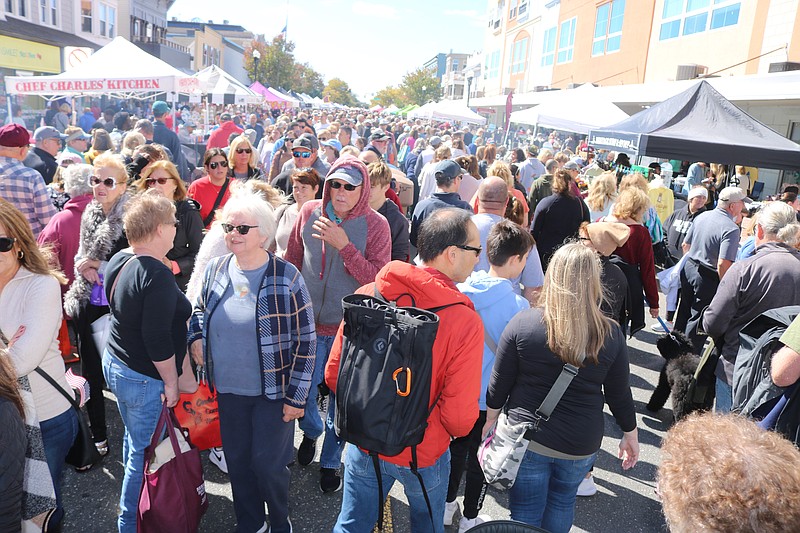 The Fall Block Party bustles in 2022 with shoppers seeking great buys under sun-splashed skies.