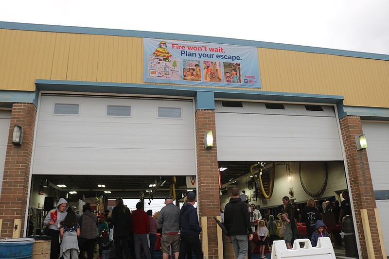 Families gather in the fire house.