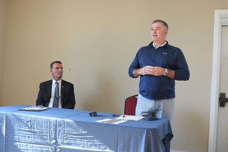 Mayor Jay Gillian listens while First Ward Councilman Terry Crowley Jr. addresses residents at the meeting.