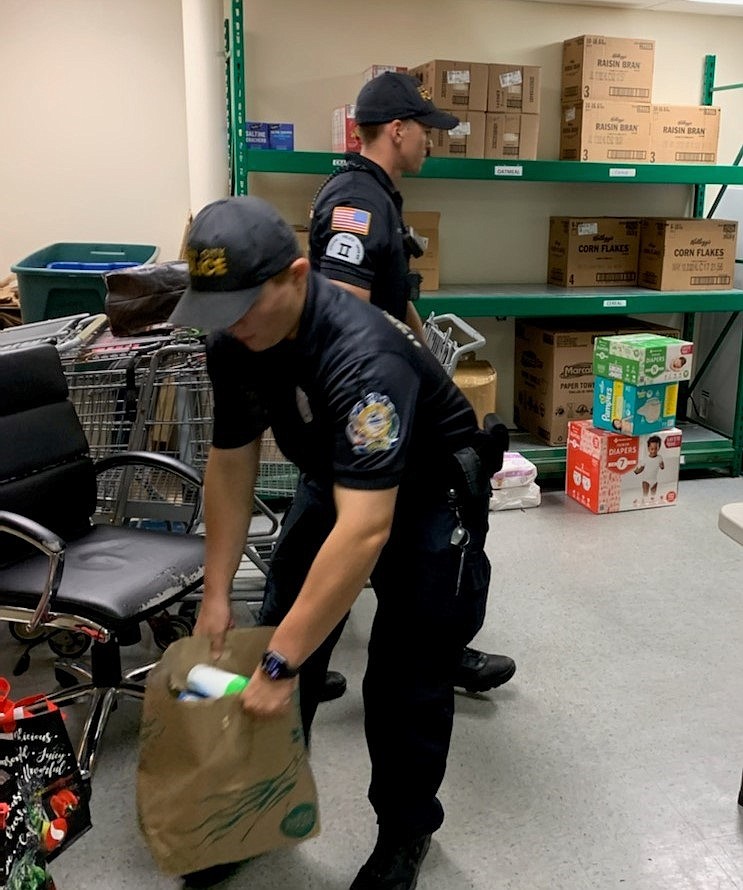 Officers deliver the bags at the end of the event. (Photo courtesy of Regina Ralston)