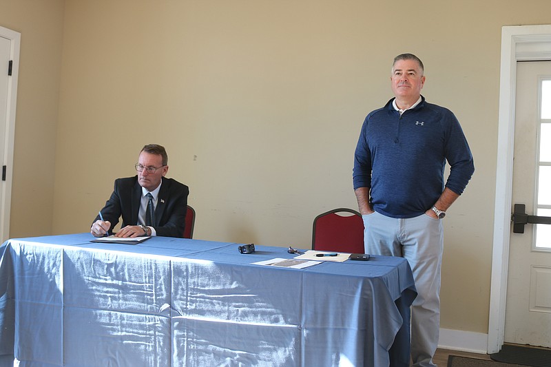 Mayor Jay Gillian takes notes, while First Ward Councilman Terry Crowley hears from residents.