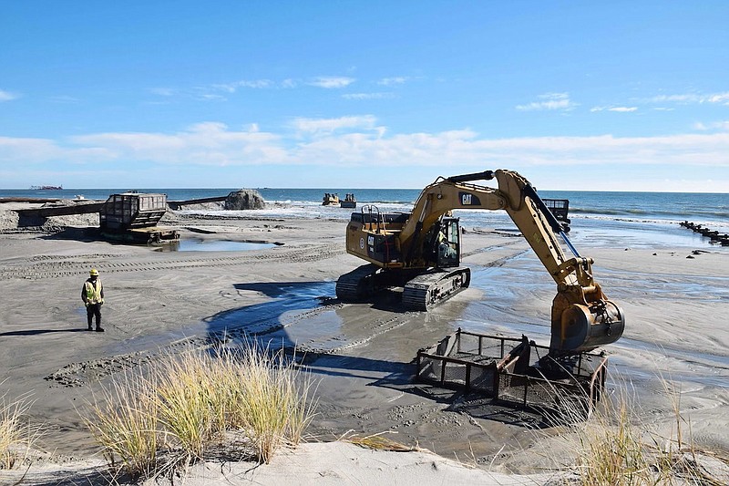 Heavy construction equipment is used during a previous beach replenishment project in Ocean City. (Photo courtesy of U.S. Army Corps of Engineers)