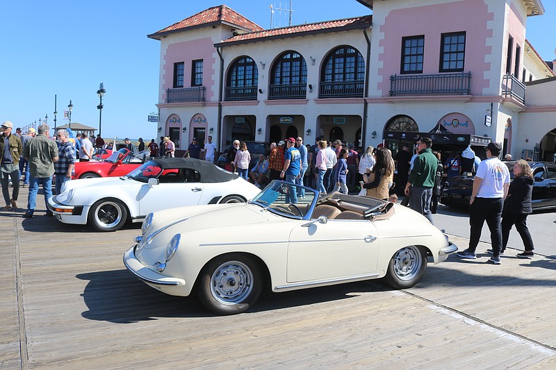 The Ocean City Music Pier serves as the backdrop for a display of classic and contemporary Porsches.