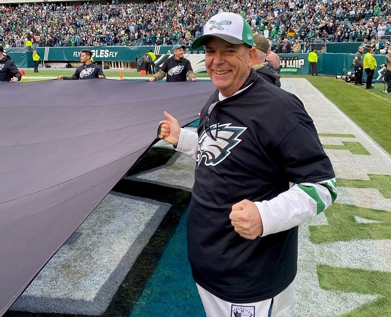 Tim Kelly, who was a huge sports fan, attends an Eagles game in November 2021.