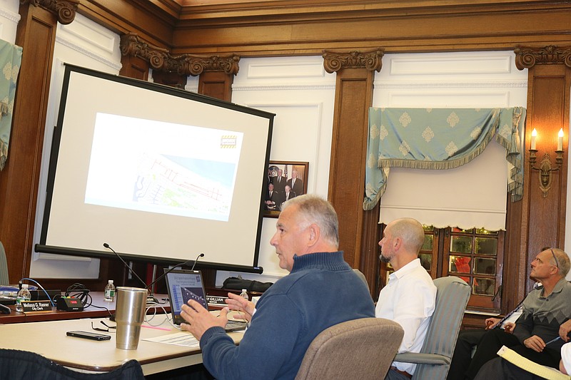 Vince Bekier, foreground, director of the city's Operations and Engineering Department, and Frank Donato, the city's chief financial officer, give a presentation to City Council on the new capital plan.