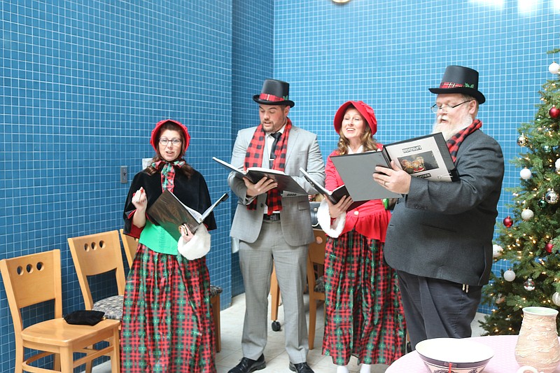 Carolers serenade the crowd.