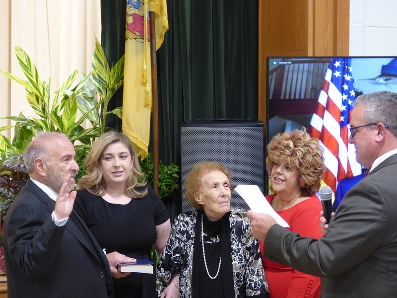 Joined by his family, Commission Director Leonard Desiderio takes the oath of office from former Superior Court Judge Michael Donohue. (Photos courtesy of Cape May County)