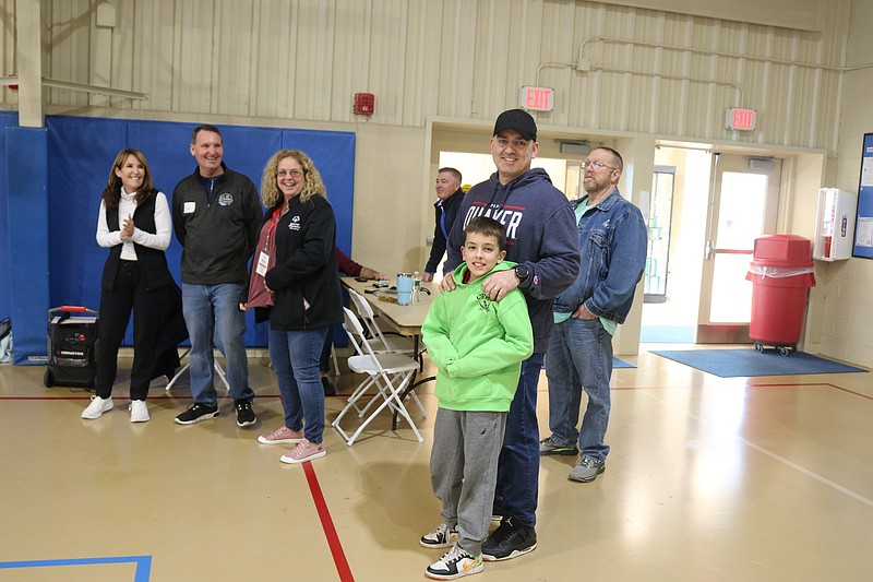 City Councilman Tom Rotondi with son, Tom, watch the players, as city officials look on.