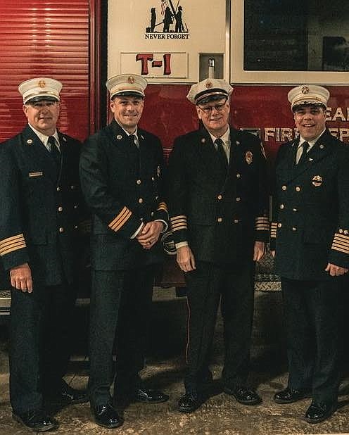 Newly-minted Battalion Chief Rick Bickmore, second from left with Fire Chief Jim Smith, far right, and other high ranking fire officials pose after the ceremony. (Photo courtesy of Ocean City Firefighters)