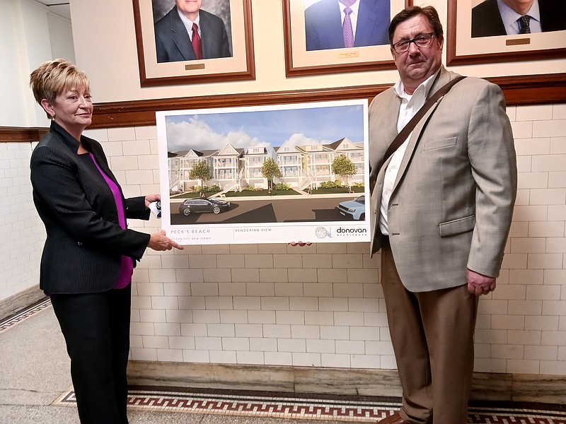 Ocean City Housing Authority Executive Director Jacqueline Jones and Architect Michael Donovan display one of the renderings for the proposed housing complex.