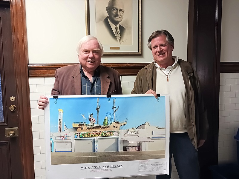 Engineer Bob Green, left, and Playland's Castaway Cove owner, Scott Simpson, hold original plans for the iconic entryway to the amusement park.