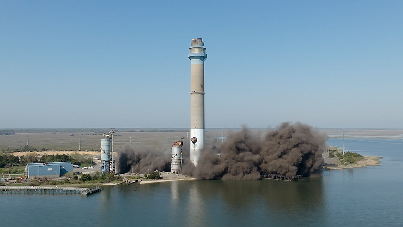 A huge plume of black smoke rises above the plant after the implosion. (Photo credit: William Kryzak, www.propixelimaging.com)