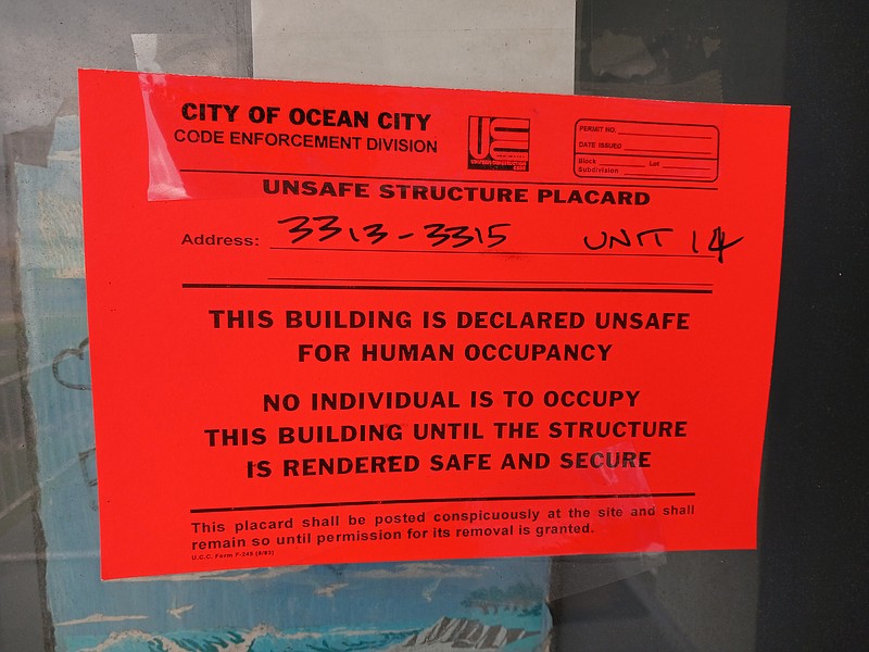 Red tags similar to these when the complex was shut down in 2023 are placed throughout the Seaspray condos to warn of .