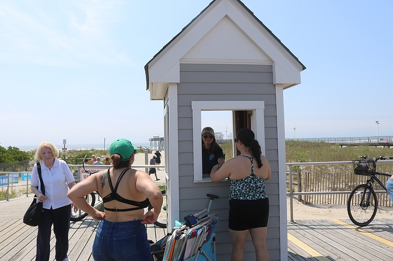 Vacationers line up to purchase beach tags in Ocean City.