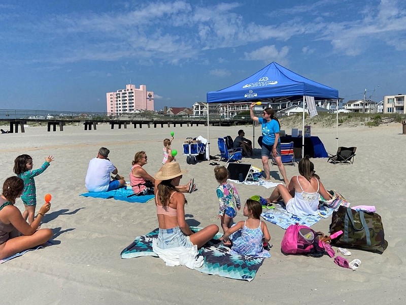 Children's Librarian Taimi Kelley reads to a crowd on July 13. (Photo courtesy of the Ocean City Free Public Library)