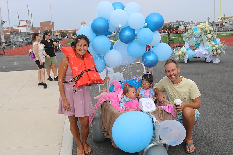 Sanda and Gil Welsford and their children, go with a sea-themed float.