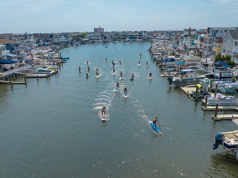 Paddleboarders have a little friendly competition. (Photo courtesy of Offshore Drones)