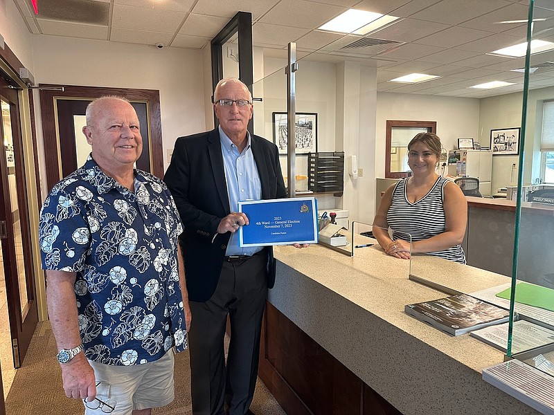 Councilman Dave Winslow, accompanied by his campaign manager Bart Russell, turns in his petition to City Clerk Melissa Rasner. (Photo courtesy of Dave Winslow)