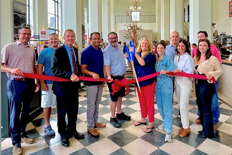 Shoppes at The Asbury Operations Director Bridget Jacobson cuts the ribbon as she is joined by the owners of the new business and dignitaries. (Photo courtesy of the Ocean City Regional Chamber of Commerce)  