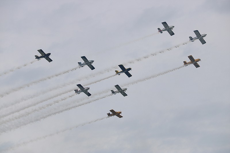 Full Throttle's team of nine planes flies together in close formation.