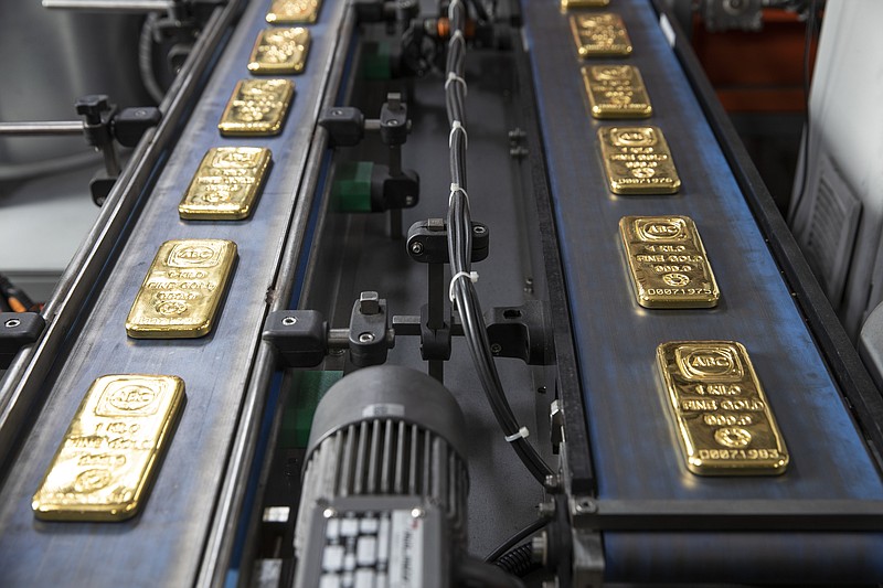 ABC Bullion, Pallion Group generic gold miner and gold producer in Marrickville. Each one of those large 400oz gold bars is worth $1.1 Million . Bullion, gold ingot, production, manufacturing, smelter, robotics. Tuesday 28th July 2020 AFR photo LOUIE DOUVIS