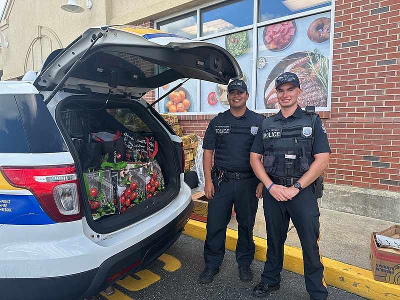 Officers Thomas Mendez-Ocampo and Josh Newman outside the 34th Street Acme for the food and goods drive. (Photo courtesy of the Ocean City Police Department)