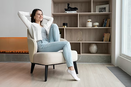 https://www.freepik.com/free-photo/full-shot-smiley-woman-sitting-chair_26393799.htm#query=person%20relaxed%20at%20home&position=6&from_view=search&track=ais