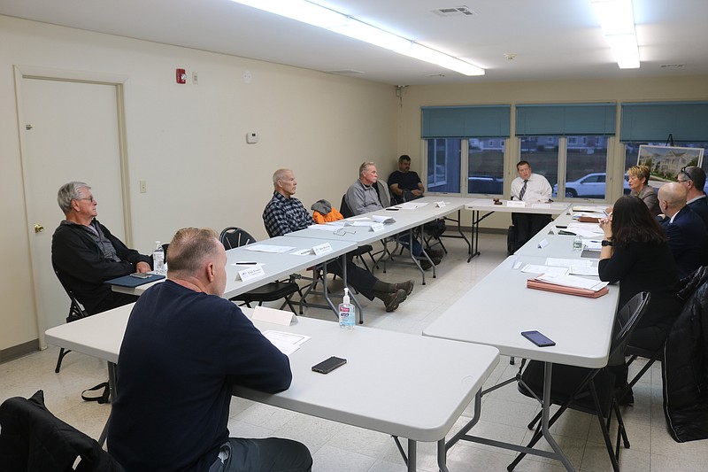 Board members of the Ocean City Housing Authority discuss the project during their meeting Tuesday.