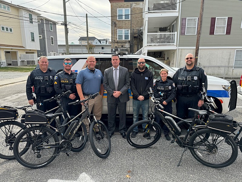 From left, Ptl. Mike Gray, Sgt. Chris Vivarelli, Capt. Clint Helphenstine, Chief Bill Campbell, Matt Krumins of Tuckahoe Bike Shop, Ptl. Kayla Ricci, and Ptl. Jack Davis display the new e-bikes. (Photo courtesy of Ocean City)