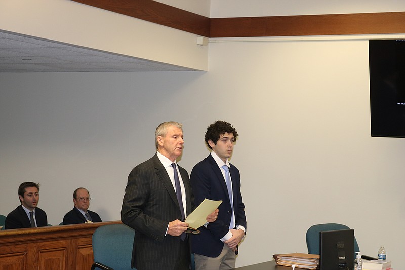 Patrick Iannone, right, stands with his defense attorney, John Tumelty, to enter his guilty plea during a hearing in state Superior Court.