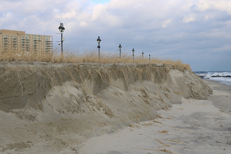 Storms erode the dunes at some of the north end beaches, including here at Fifth Street. 