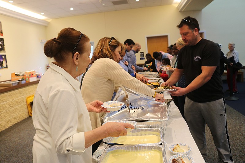 Attendees line up for soul food lunches.