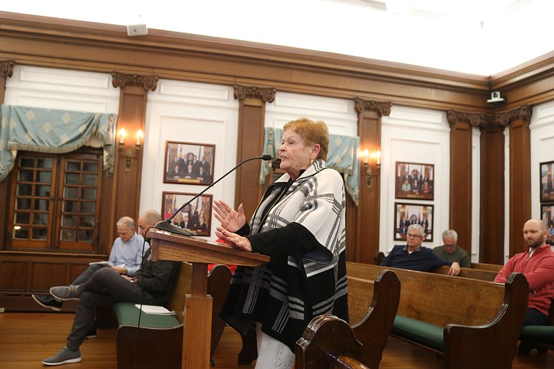 Ocean City resident Sheila Hartranft questions city officials about the financial implications of the land deal on local taxpayers.