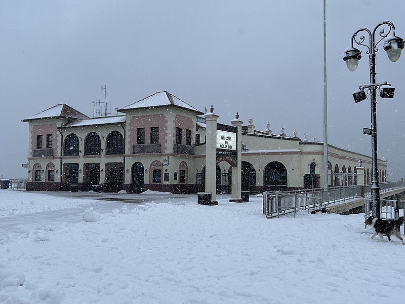 Snow covers the Ocean City Boardwalk in front of the Music Pier.