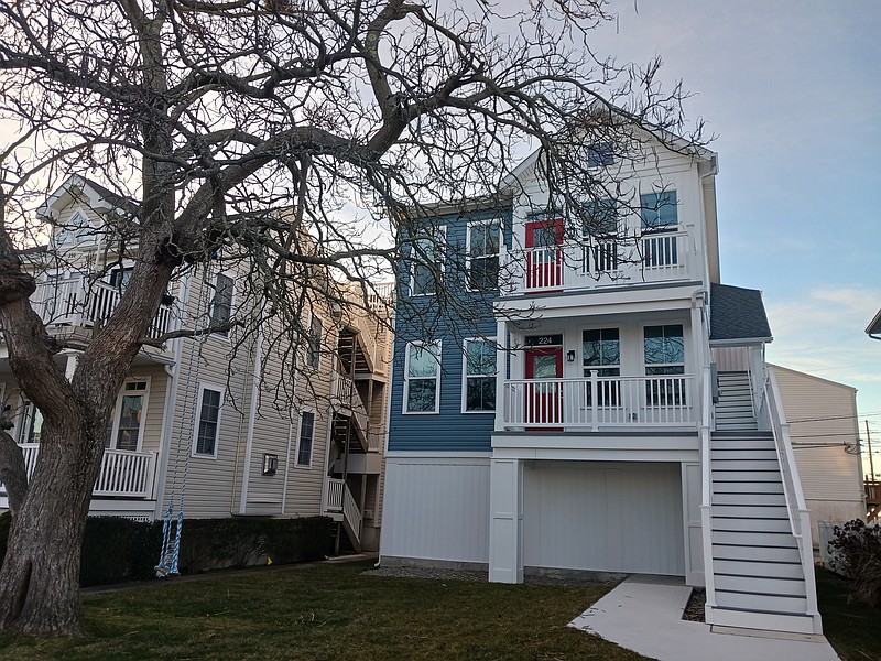 A large tree in the front yard was saved during construction of the new duplex on Simpson Avenue to satisfy the neighbors.