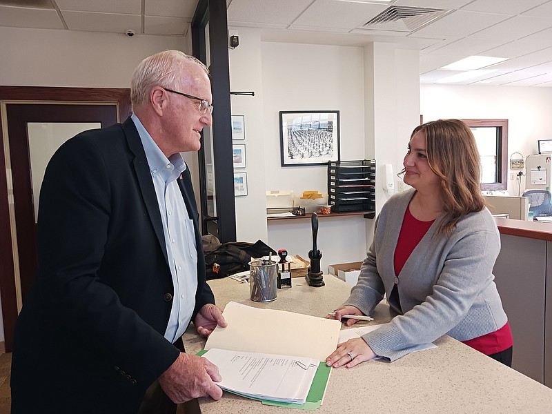 Fourth Ward Councilman Dave Winslow hands in his nominating petitions to City Clerk Melissa Rasner.