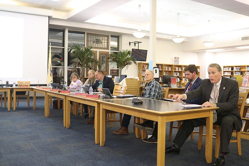 The superintendent search committee is made up of board members from foreground, Kevin Barnes, Chris Halliday, Michael Allegretto and the two women, Jacqueline McAlister and at the end, Fran Newman. 