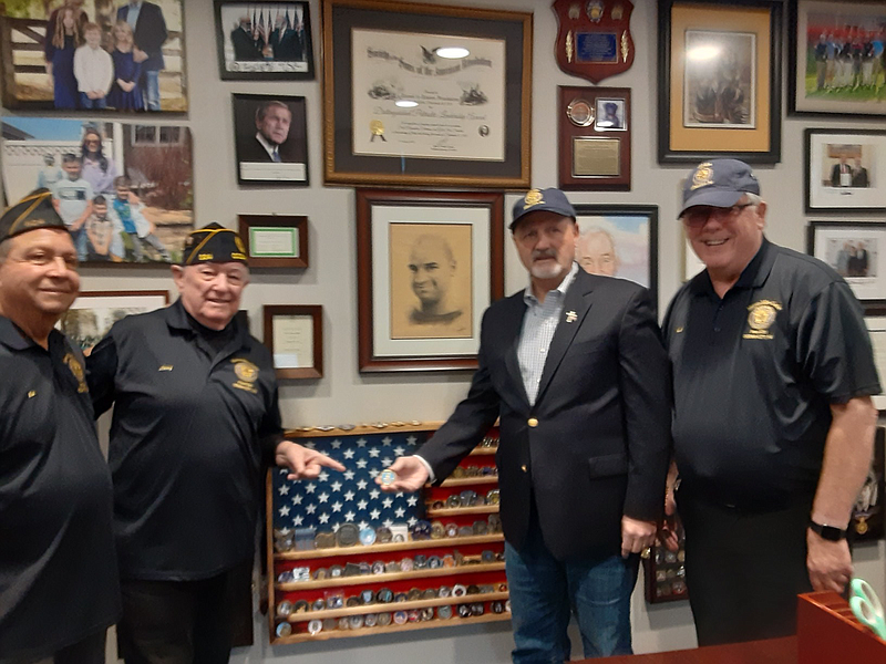 Frank Siller,  of Tunnels To Towers Foundation, holds an American Legion challenge coin presented to him by members of Post 524. 