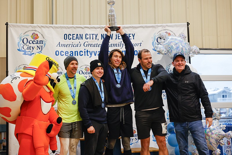 Upper Township Beach Patrol fielded the top overall team with from left, Michael Dickinson, Robert Edwards, Mike Parsons and William Schlucter, shown with Mayor Jay Gillian at right. (Photo courtesy of Ocean City)