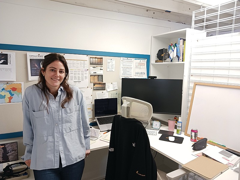 Co-owner Caitlin Quirk stands in a rented space for a working professional in the tech industry.