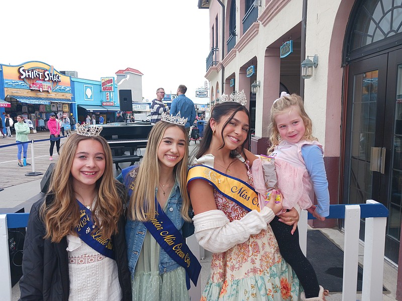 From left, Little Miss Ocean City Stella Fleming, Junior Miss Sarah Avellino and Miss Ocean City Lola DeMarco visit with Hayden Dion, 4, of Somers Point. 