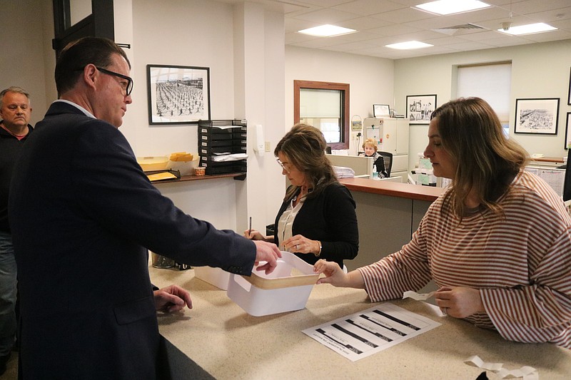 At-Large Council candidate Mike DeVlieger makes his selection from the egg basket.