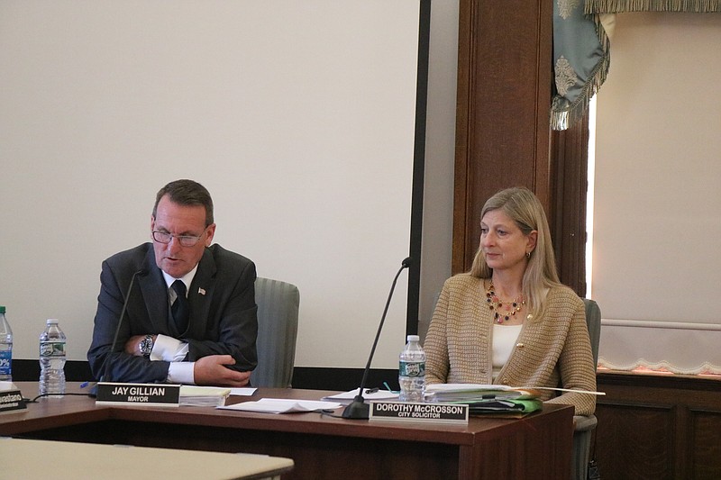 Mayor Jay Gillian reads from his State of the City address while City Solicitor Dorothy McCrosson listens.