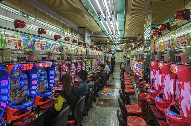 Photo credit - https://unsplash.com/photos/people-sitting-on-red-plastic-chairs-inside-building-QX0SWFpB2ho