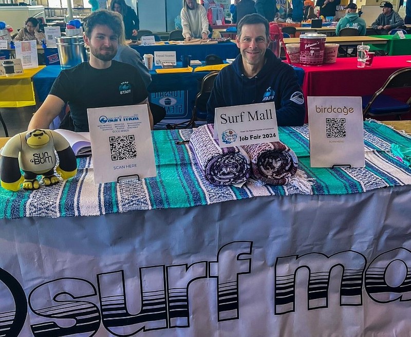 Wes Kazmarck, right, owner of Surf Mall, pictured at the job fair with surf mall manager Kyle Howey. (Photo courtesy of the Chamber of Commerce)