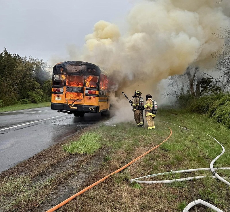 Emergency personnel extinguish the blaze.