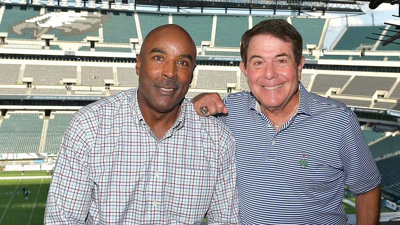 Former Eagles wide receiver Mike Quick is shown with radio broadcast partner Merrill Reese. (Courtesy of Philadelphia Eagles)